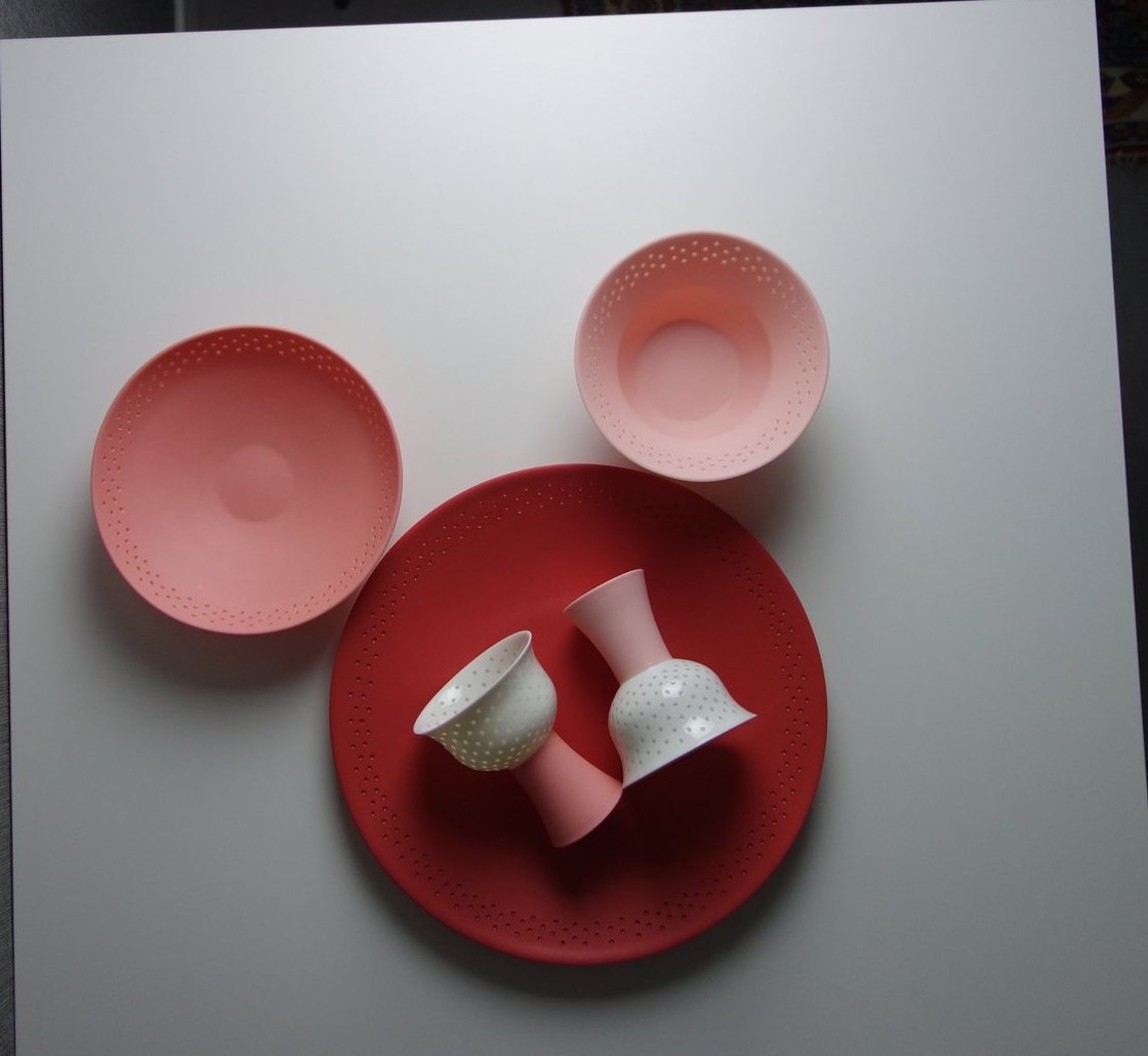 A Firefly dinner set in coral, blush and deep red